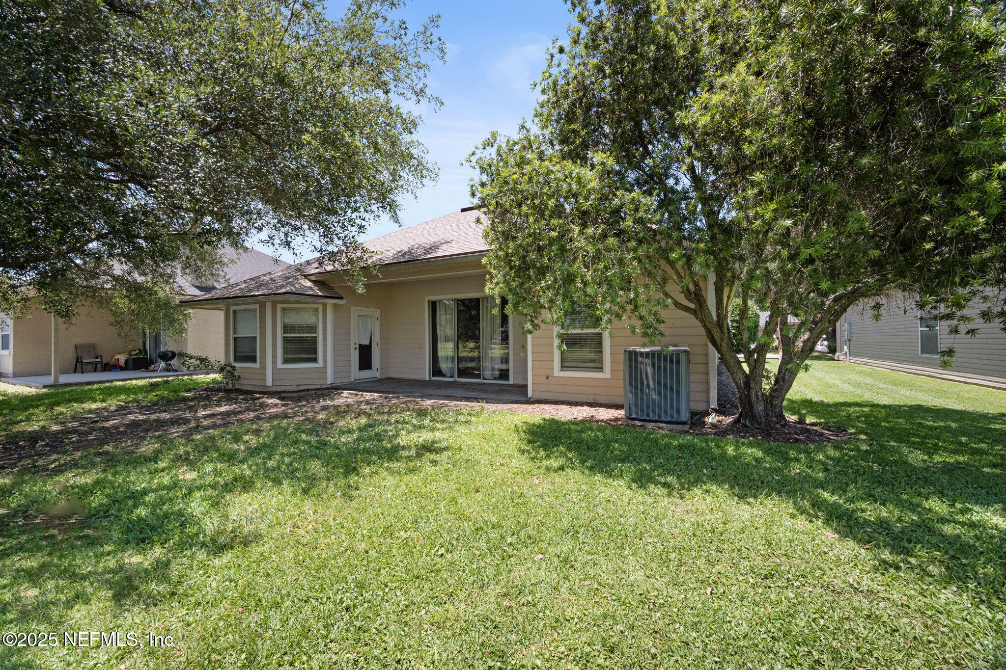 96316 Ridgewood Circle Fernandina Beach, FL 32034 - Photo 31 of 32 a view of a house with a yard