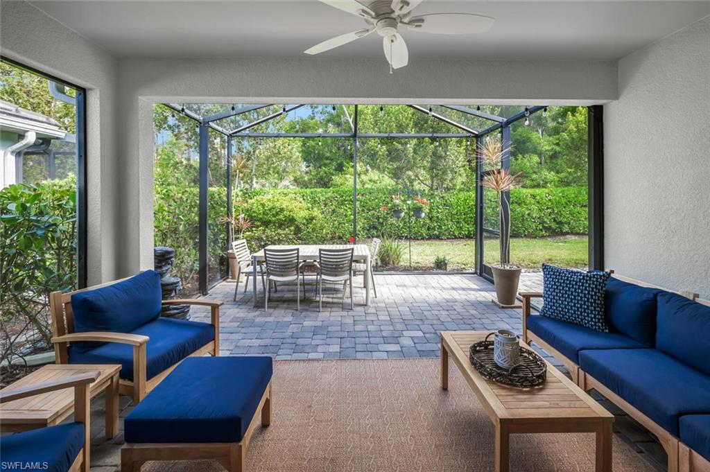 2211 Marquesa Circle Naples, FL 34112 - Photo 1 of 28 a living room with furniture and a large window