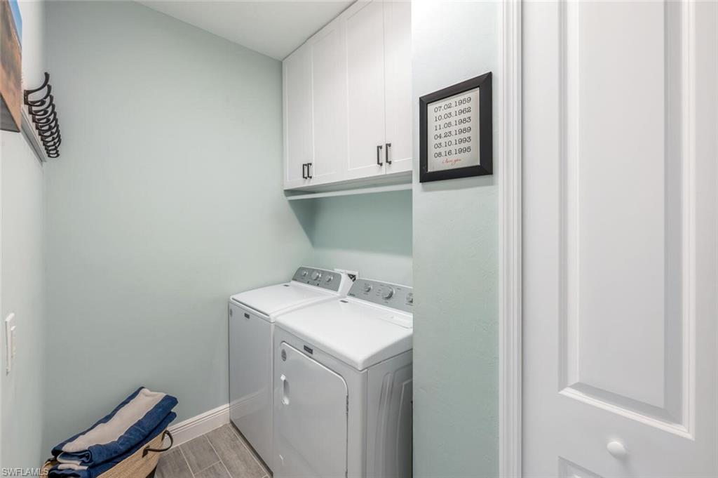 2211 Marquesa Circle Naples, FL 34112 - Photo 18 of 28 a utility room with a sink washer and dryer