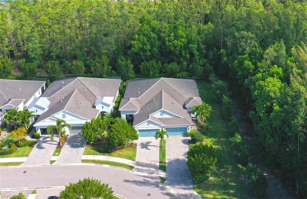 2211 Marquesa Circle Naples, FL 34112 - Photo 4 of 28 an aerial view of a house with garden space and street view