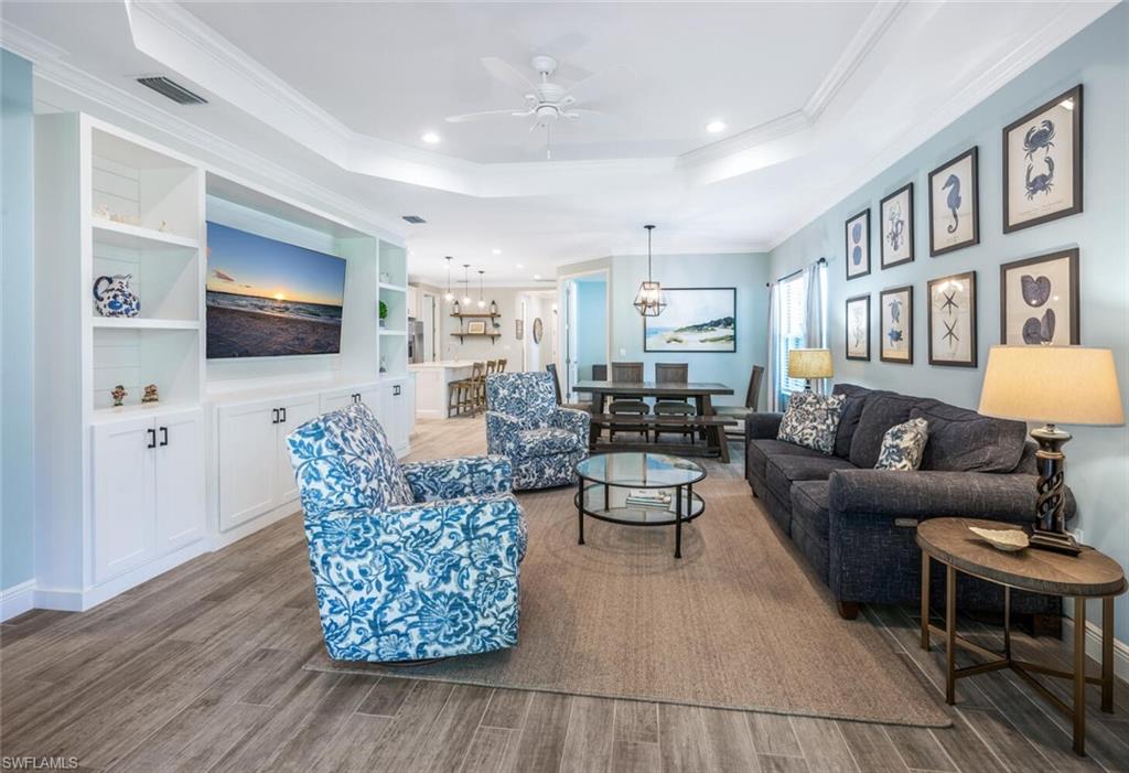 2211 Marquesa Circle Naples, FL 34112 - Photo 5 of 28 a living room with furniture and a flat screen tv