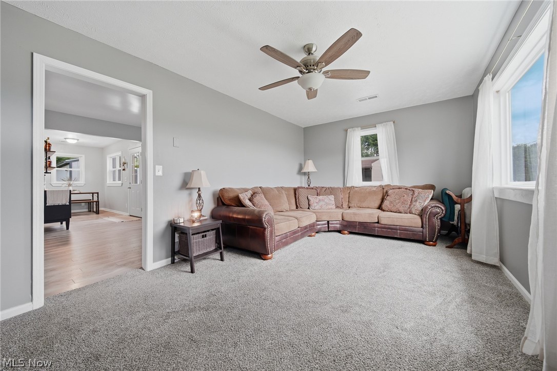 3471 State Rte 5 Newton Falls, OH 44444 - Photo 3 of 31 Spacious room featuring light gray walls, gray carpet, and white trim