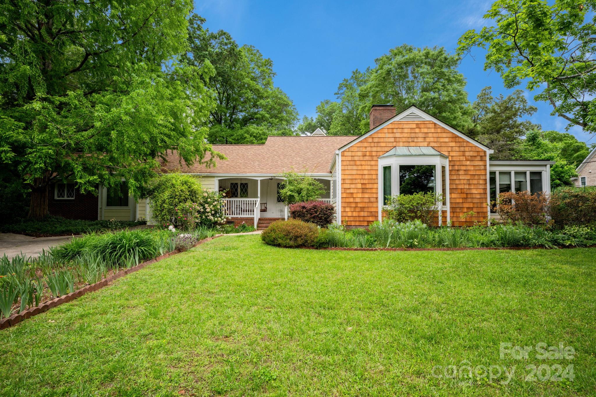 559 Lorimer Road Davidson, NC 28036 - Photo 1 of 39 a view of a house with backyard and garden