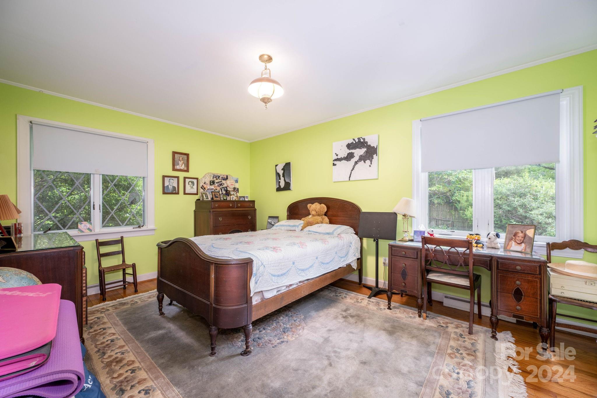 559 Lorimer Road Davidson, NC 28036 - Photo 20 of 39 a bedroom with a bed and a large window