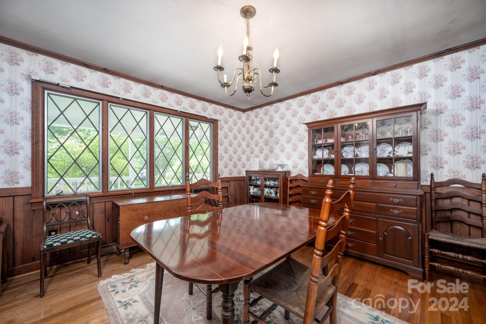 559 Lorimer Road Davidson, NC 28036 - Photo 9 of 39 a dining room with furniture a rug and a large window