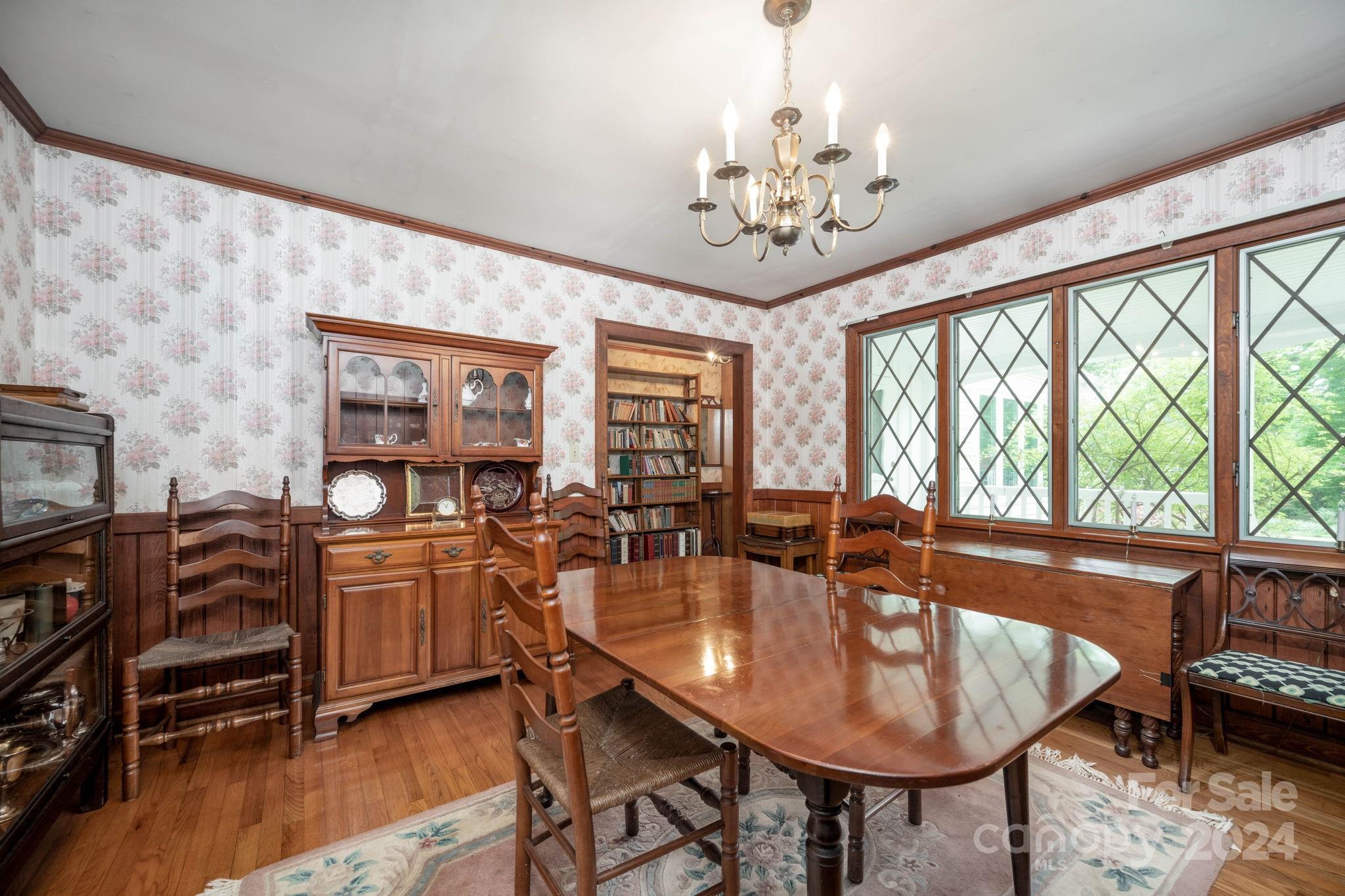 559 Lorimer Road Davidson, NC 28036 - Photo 10 of 39 a dining room with furniture a window and wooden floor