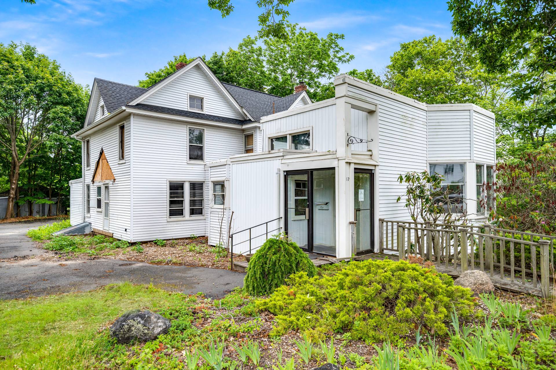 57 Mill Road Westhampton Beach, NY 11978 - Photo 11 of 20 a front view of a house with garden
