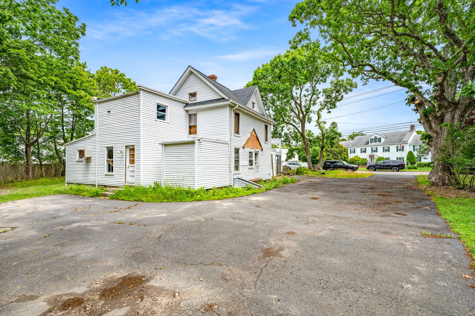 57 Mill Road Westhampton Beach, NY 11978 - Photo 13 of 20 a view of a house with a yard and large tree
