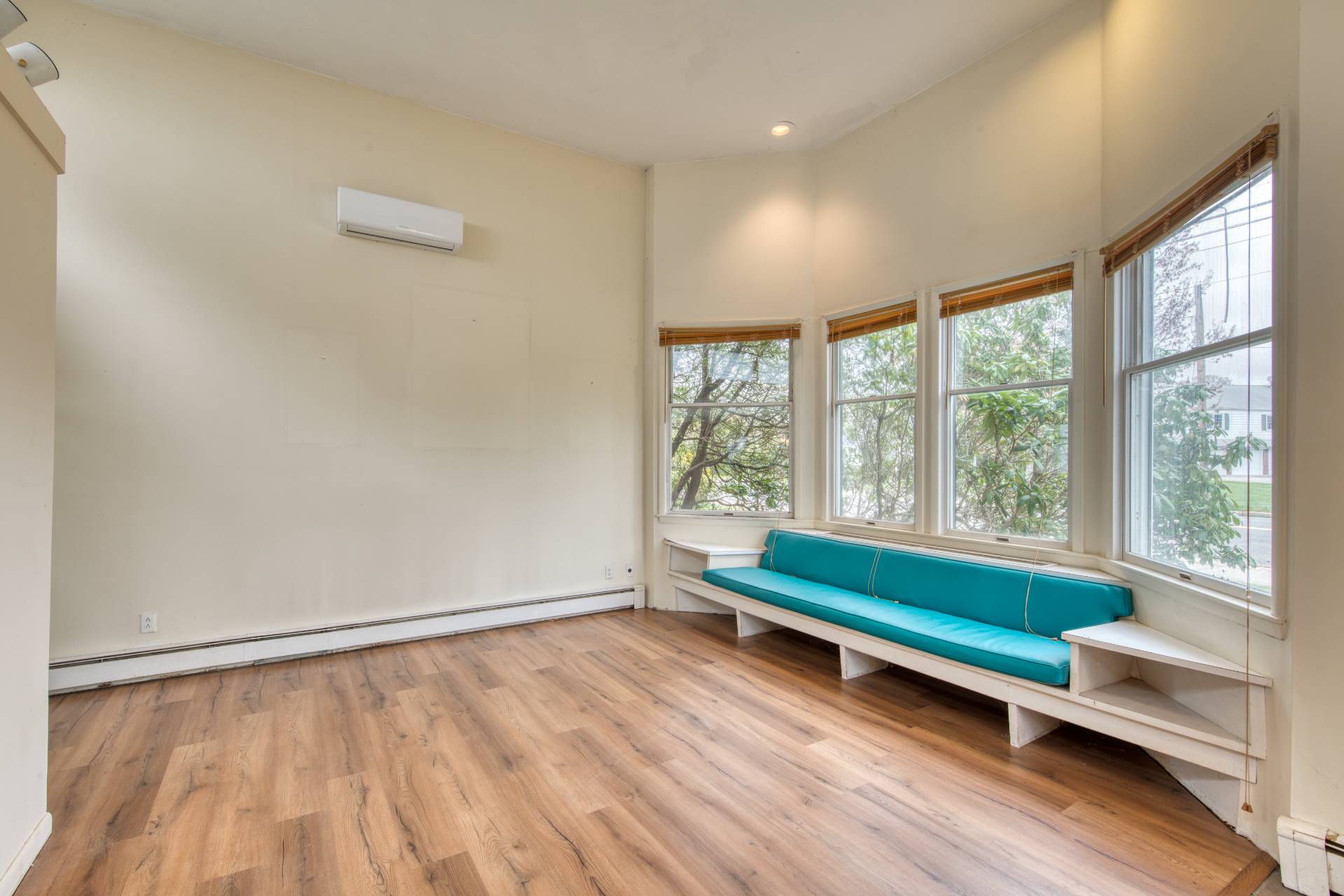 57 Mill Road Westhampton Beach, NY 11978 - Photo 15 of 20 a view of a room with wooden floor and outdoor view