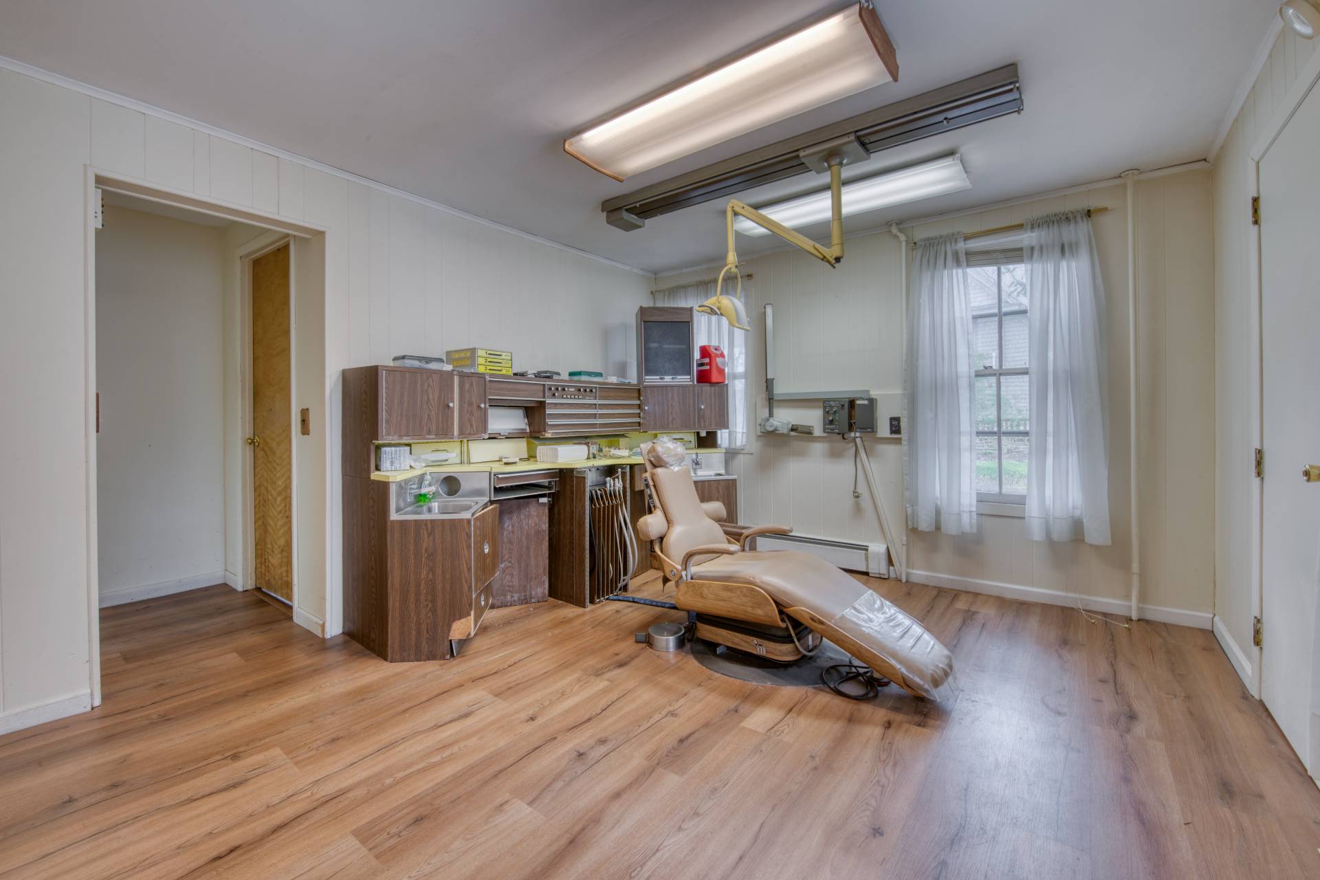 57 Mill Road Westhampton Beach, NY 11978 - Photo 16 of 20 a view of a room with wooden floor and furniture