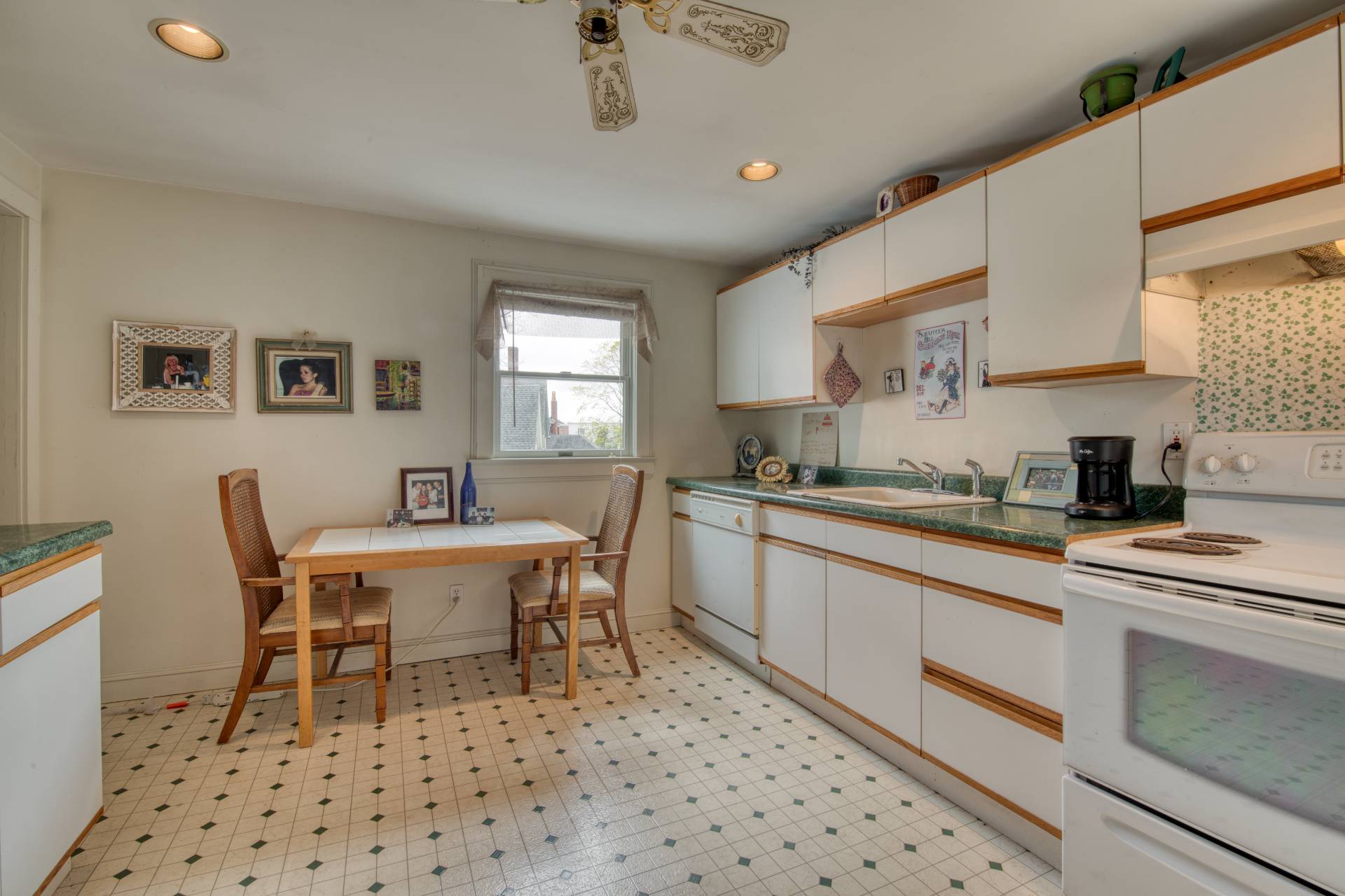 57 Mill Road Westhampton Beach, NY 11978 - Photo 17 of 20 a kitchen with a dining table chairs and a window