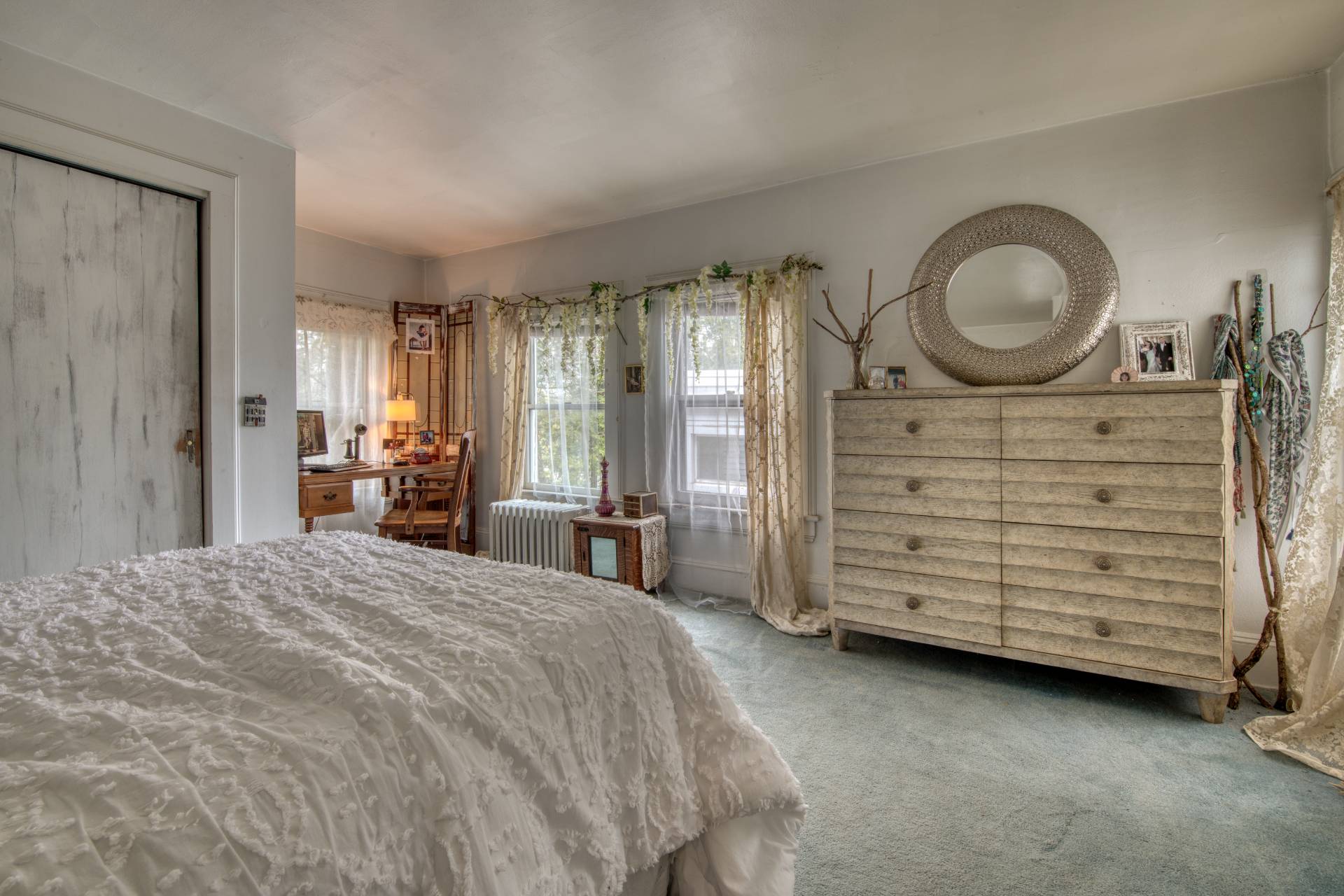 57 Mill Road Westhampton Beach, NY 11978 - Photo 19 of 20 a bedroom with a bed and a dresser