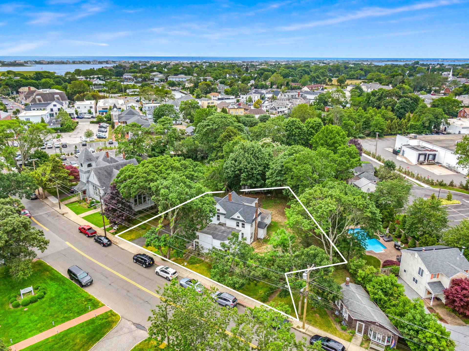 57 Mill Road Westhampton Beach, NY 11978 - Photo 2 of 20 an aerial view of residential houses with outdoor space and trees