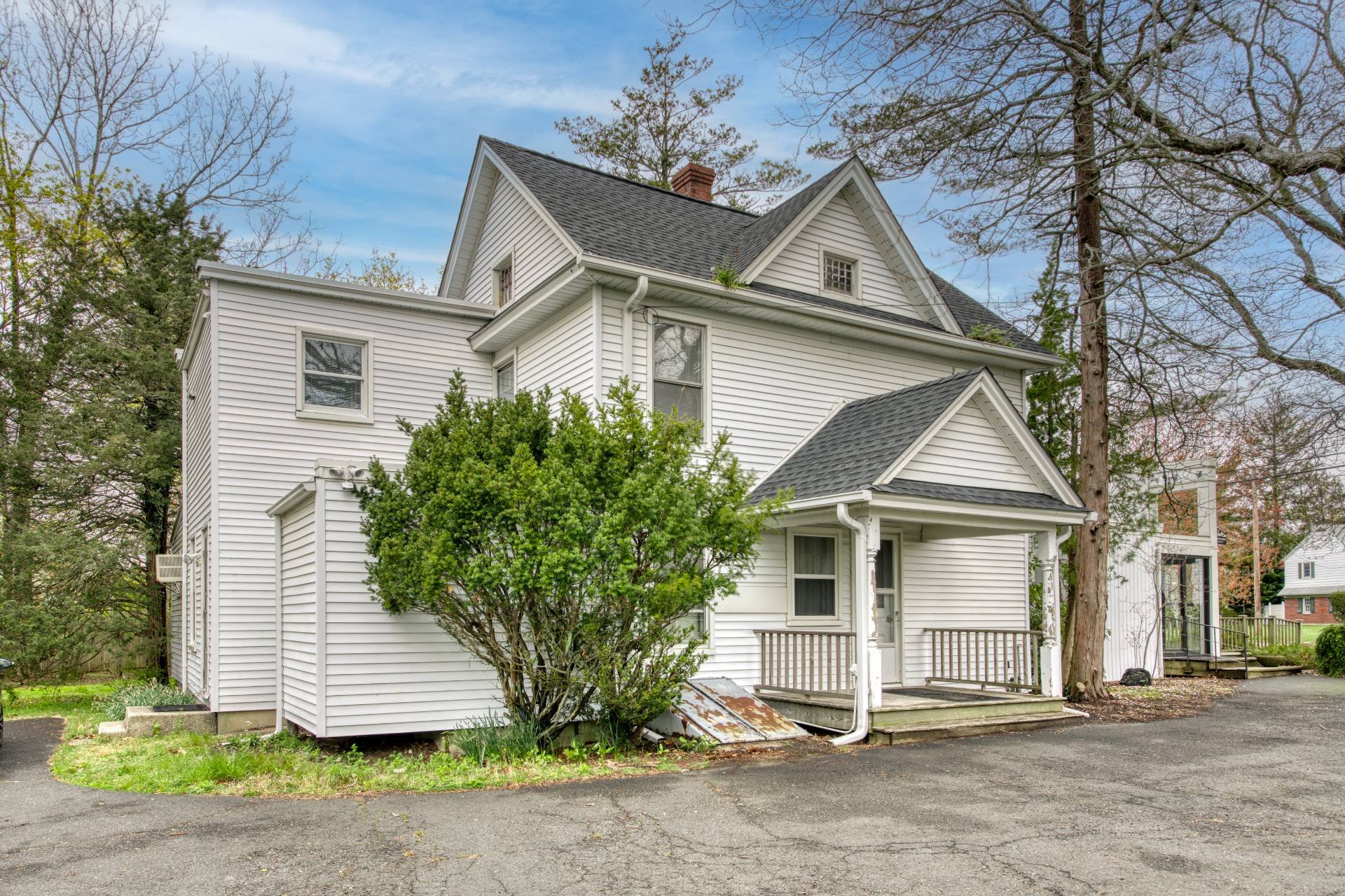 57 Mill Road Westhampton Beach, NY 11978 - Photo 9 of 20 a front view of a house with a yard and garage