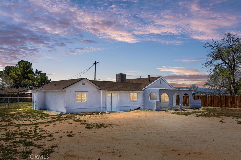 22889 Cahuilla Road Apple Valley, CA 92307 - Photo 1 of 1 a front view of a house with a yard