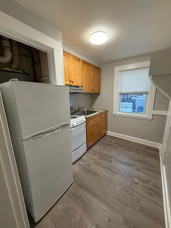 a view of a kitchen with microwave and cabinets