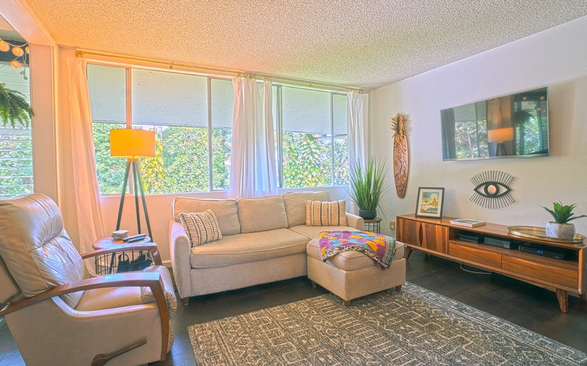 a living room with furniture and a large window