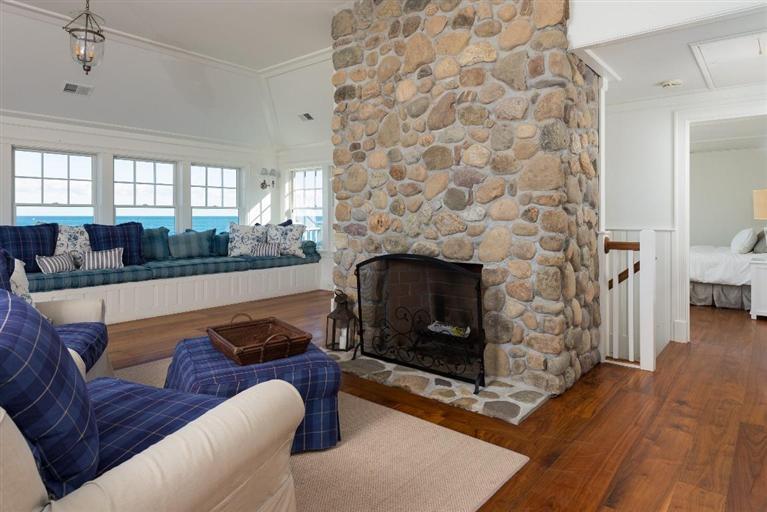 31 Starboard Lane Mashpee, MA 02649 - Photo 18 of 35 a living room with furniture and a fireplace