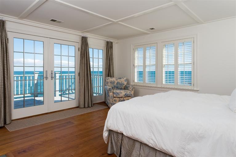 31 Starboard Lane Mashpee, MA 02649 - Photo 22 of 35 a spacious bedroom with a large bed and a large window