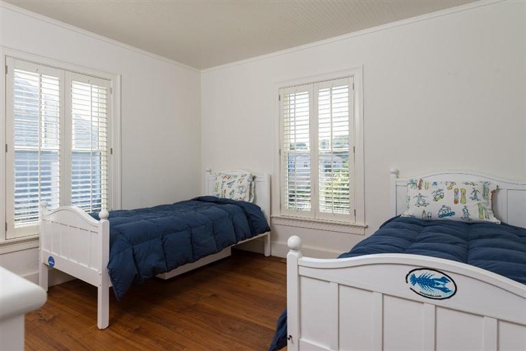 31 Starboard Lane Mashpee, MA 02649 - Photo 30 of 35 a bedroom with a bed and a chair