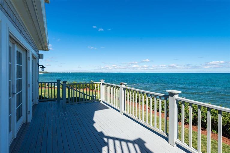 31 Starboard Lane Mashpee, MA 02649 - Photo 7 of 35 a view of a balcony with wooden floor and chair