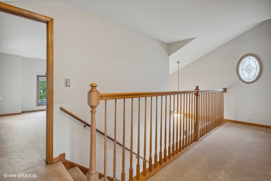 208 South Rush Street Itasca, IL 60143 - Photo 11 of 33 a view of a hallway with wooden floor