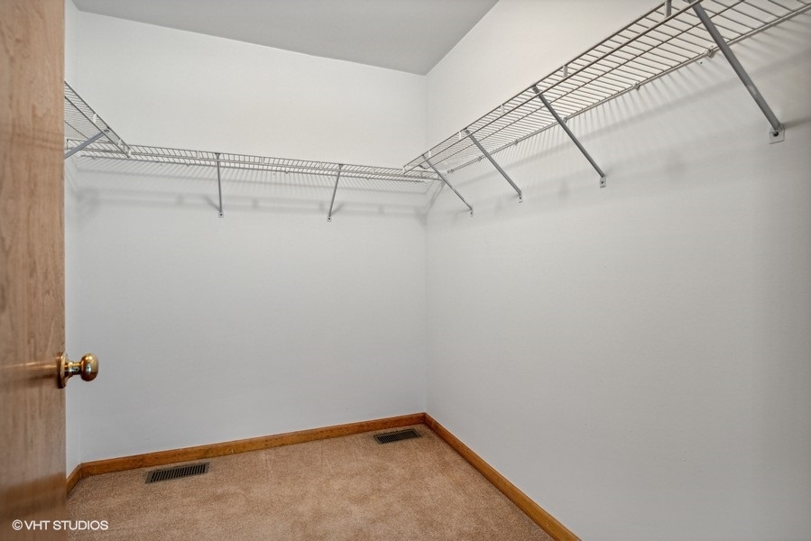 208 South Rush Street Itasca, IL 60143 - Photo 15 of 33 a view of a room with racks on the wall