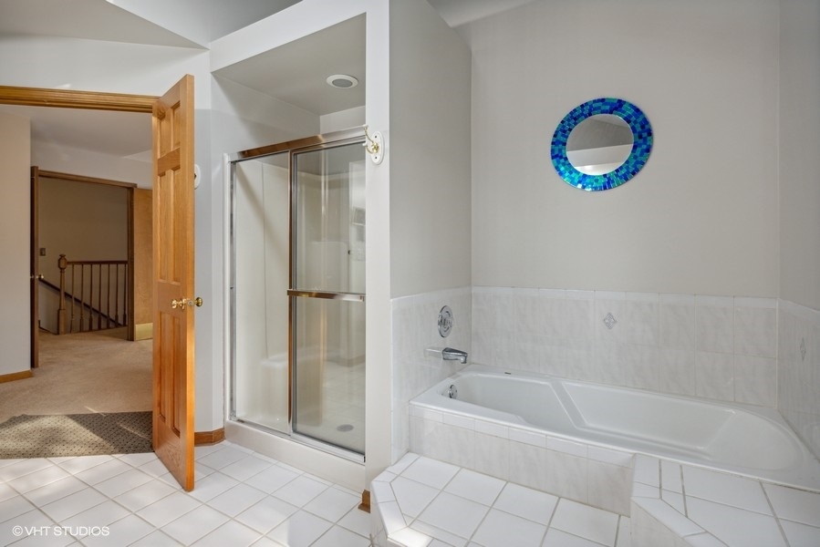 208 South Rush Street Itasca, IL 60143 - Photo 18 of 33 a bathroom with a tub and a shower