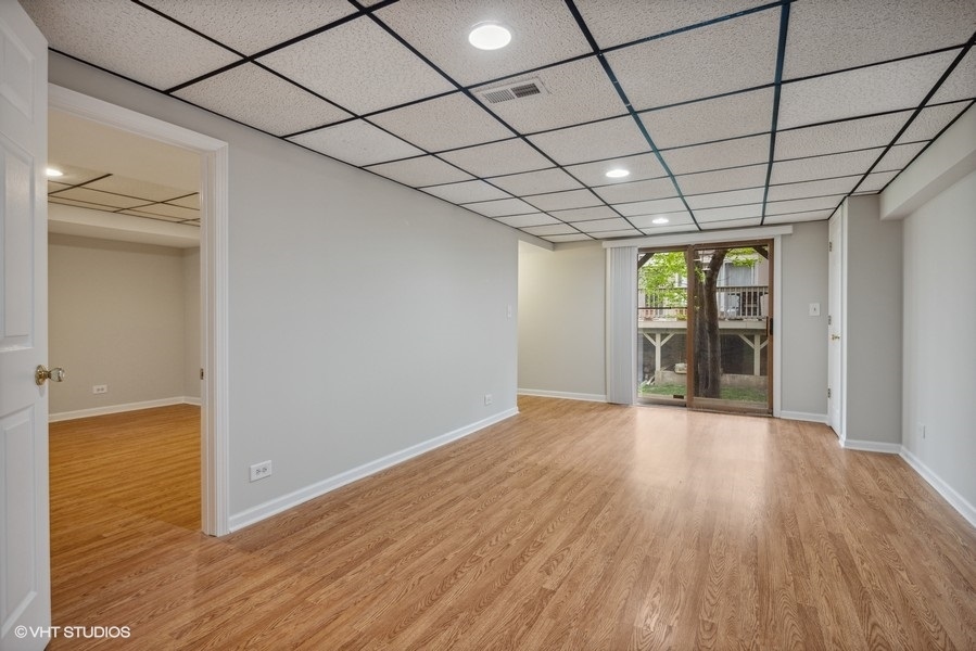 208 South Rush Street Itasca, IL 60143 - Photo 24 of 33 a view of empty room with wooden floor and fan
