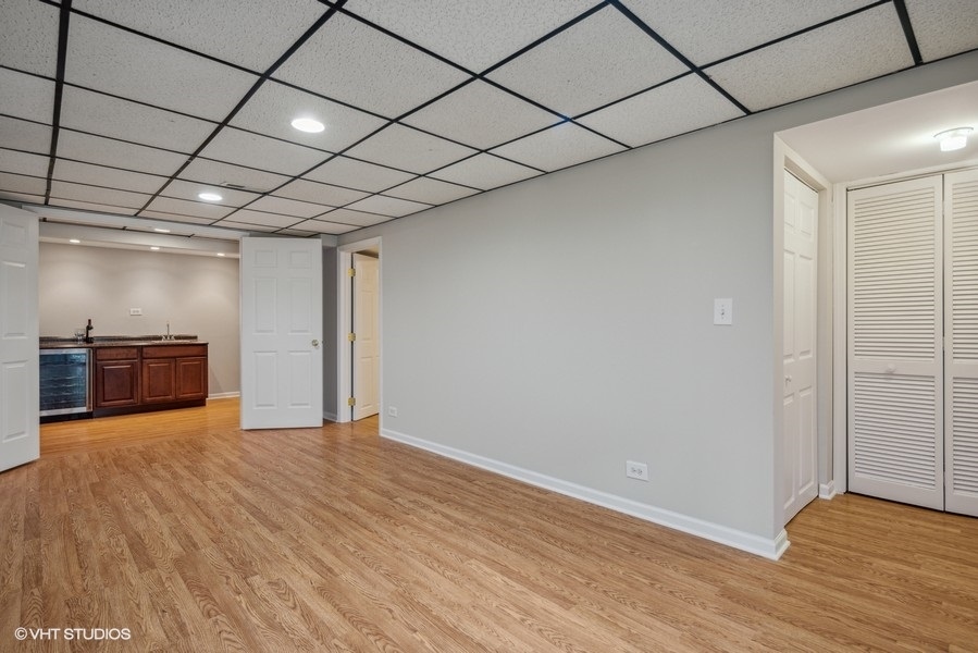 208 South Rush Street Itasca, IL 60143 - Photo 25 of 33 a view of hallway with wooden floor