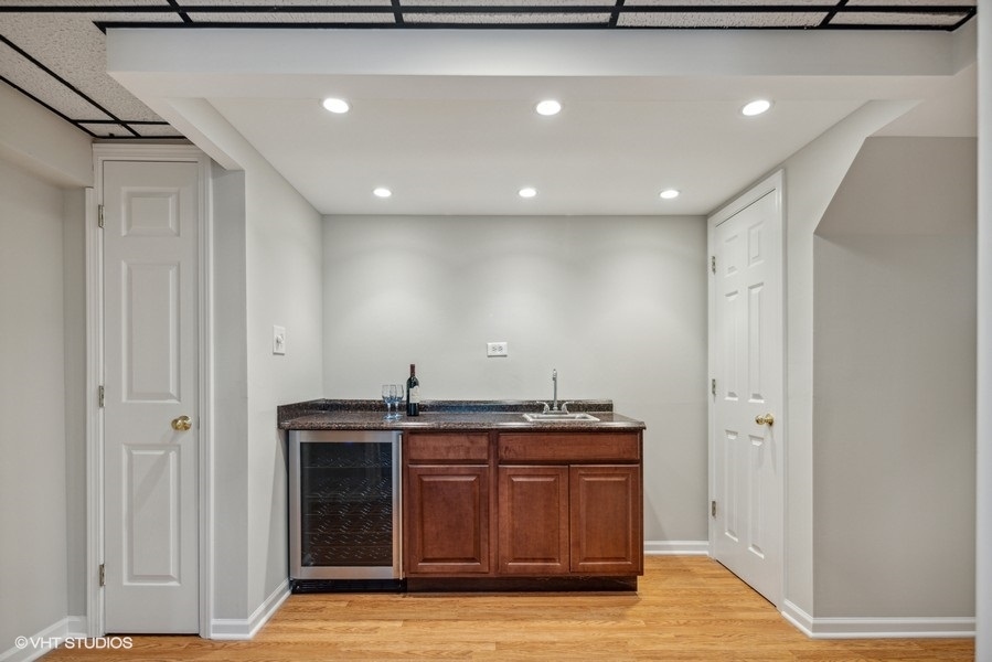 208 South Rush Street Itasca, IL 60143 - Photo 26 of 33 a kitchen with a sink and cabinets