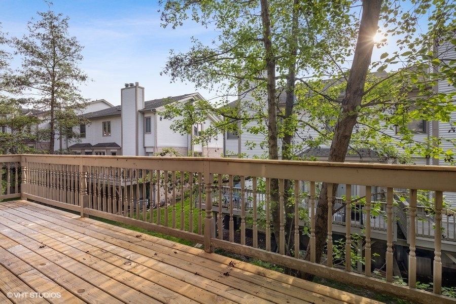 208 South Rush Street Itasca, IL 60143 - Photo 29 of 33 a view of a balcony with wooden floor and fence