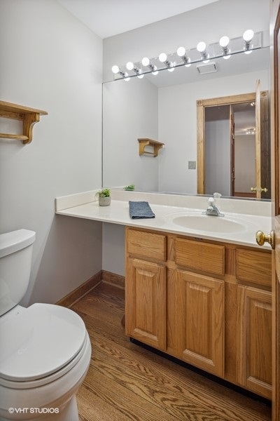 208 South Rush Street Itasca, IL 60143 - Photo 9 of 33 a bathroom with a sink and a mirror