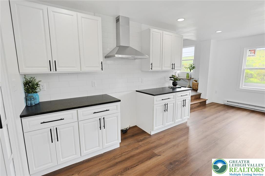 121 Ben Titus Road Tamaqua, PA 18252 - Photo 21 of 48 a kitchen with granite countertop white cabinets and white appliances