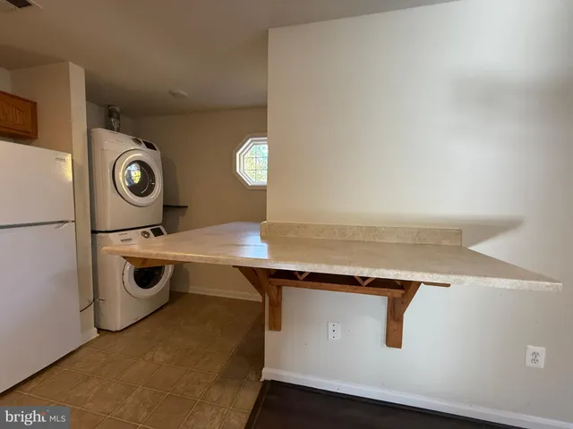 a utility room with washer and dryer