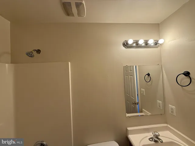 a bathroom with a mirror