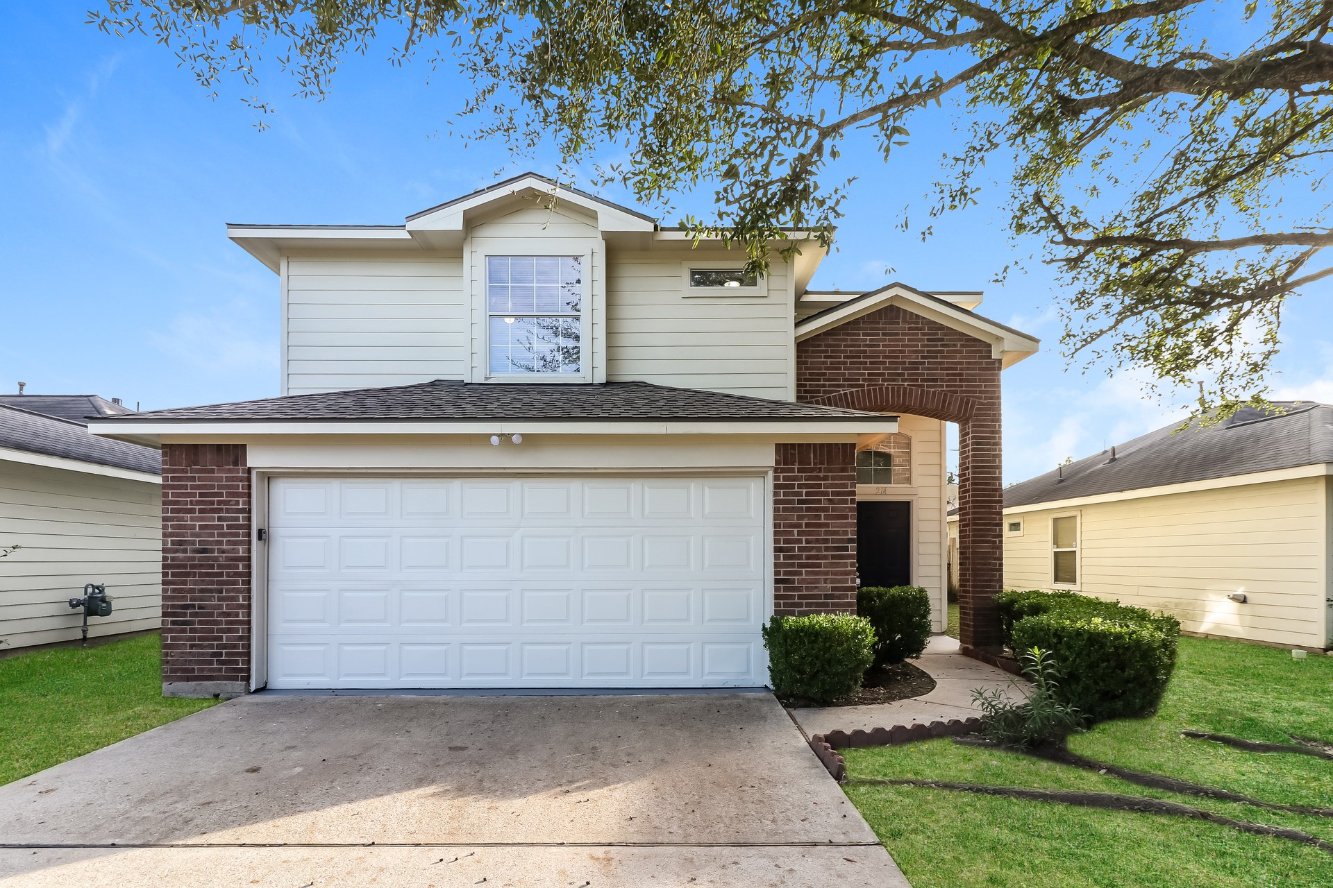 214 North Native Lane Houston, TX 77022 - Photo 1 of 18 a front view of a house with a yard and garage