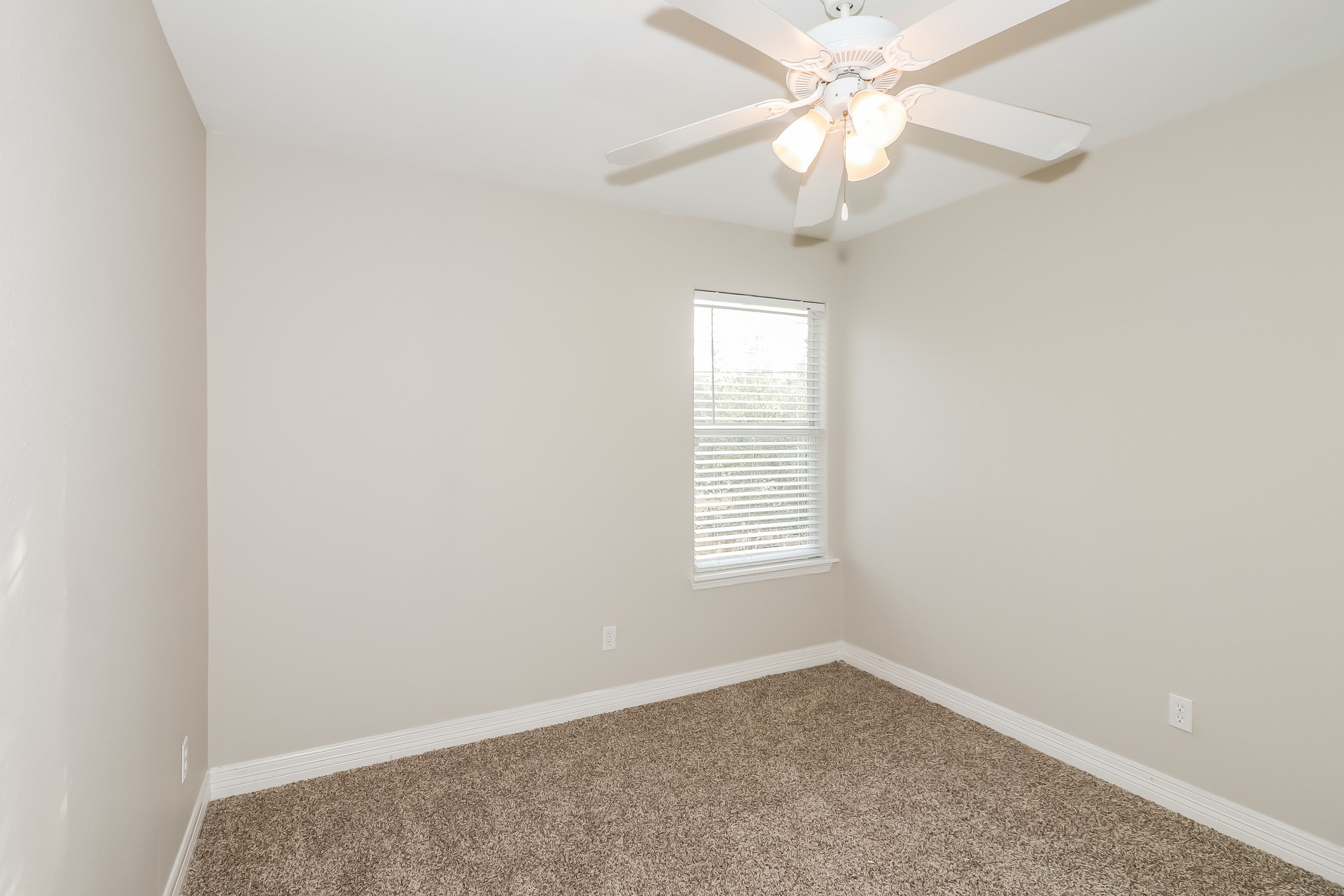 214 North Native Lane Houston, TX 77022 - Photo 13 of 18 an empty room with a window and a fan