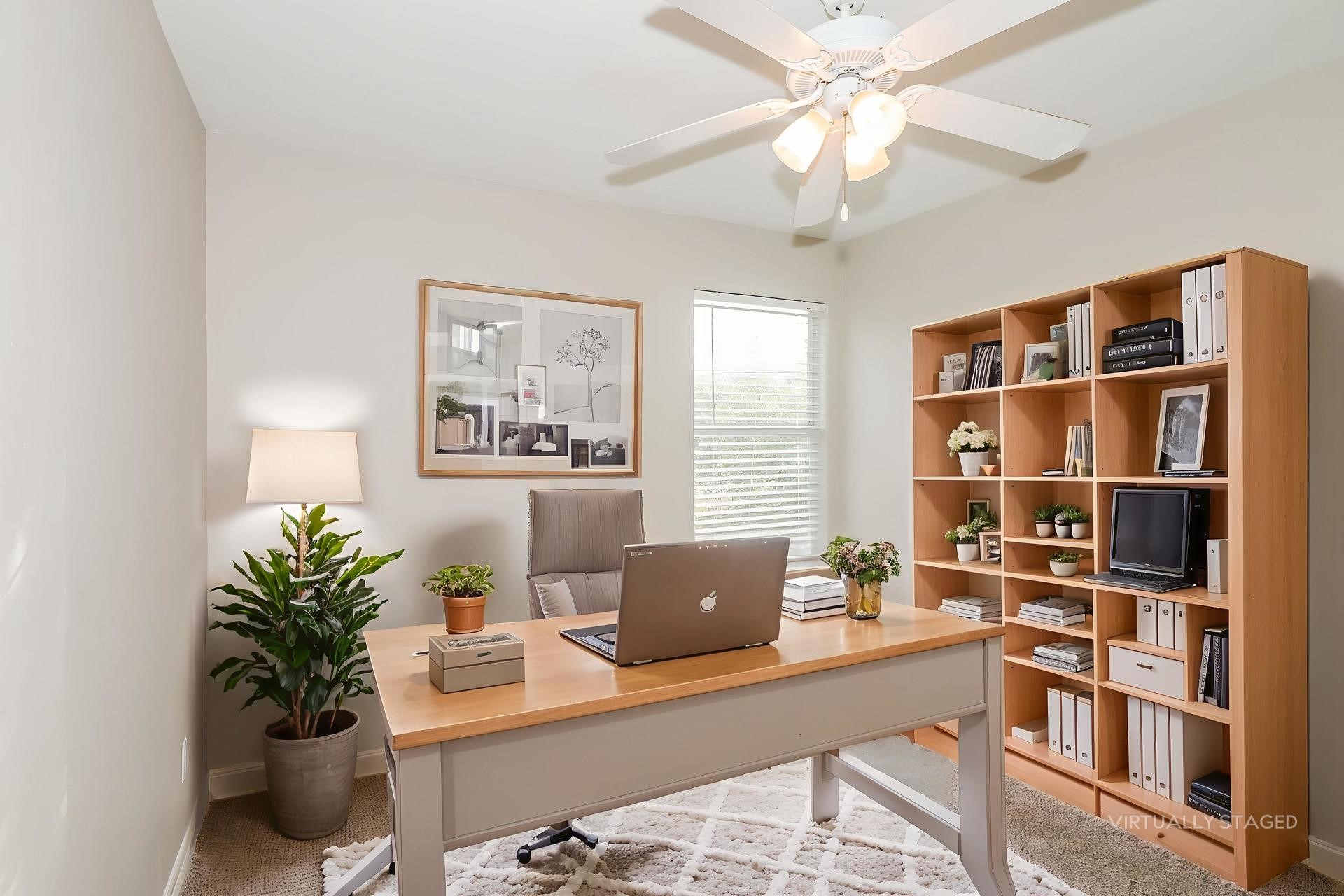 214 North Native Lane Houston, TX 77022 - Photo 14 of 18 a workstation with a bookshelf a chair and a bookshelf with wooden floor