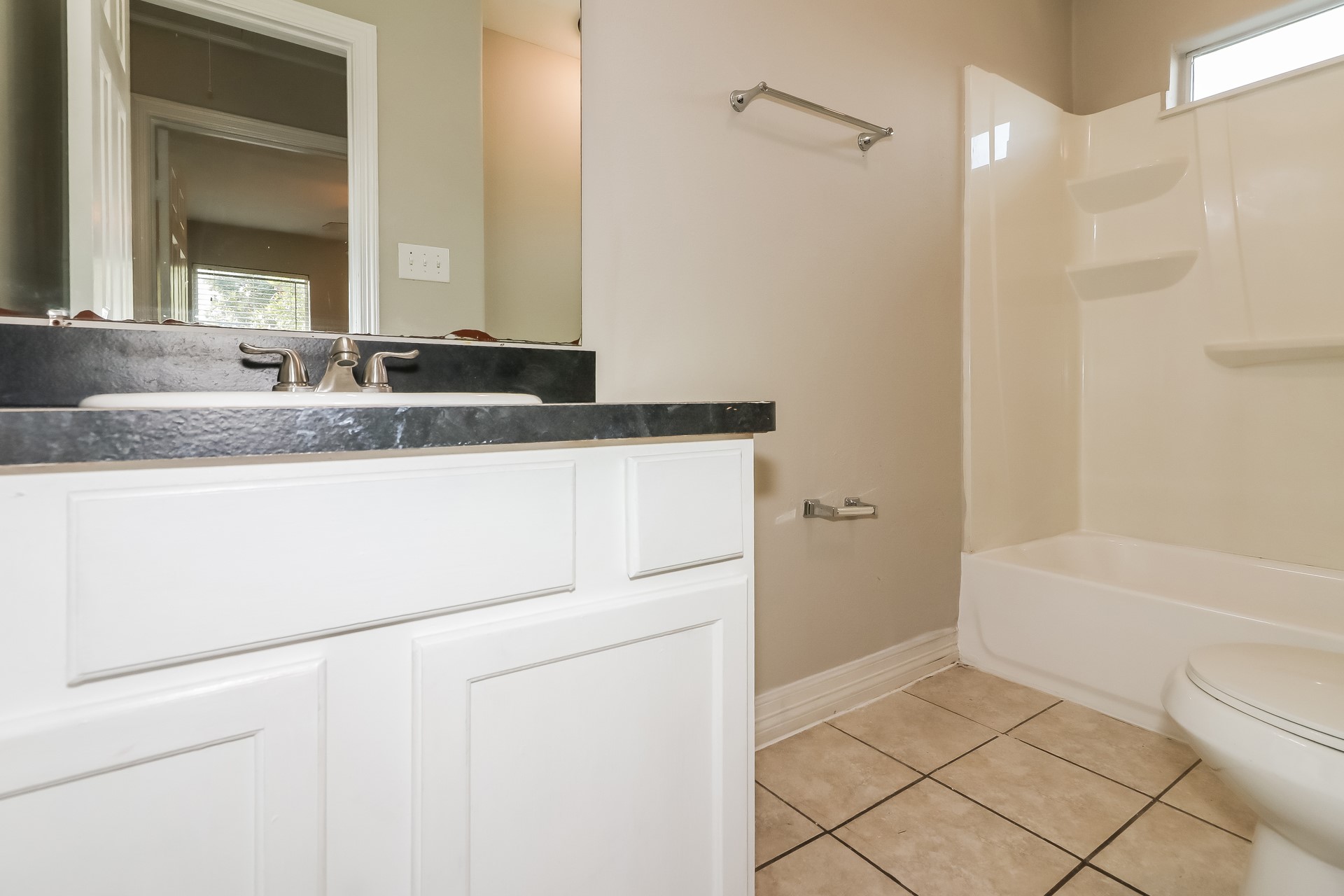 214 North Native Lane Houston, TX 77022 - Photo 17 of 18 a bathroom with a granite countertop sink and a mirror