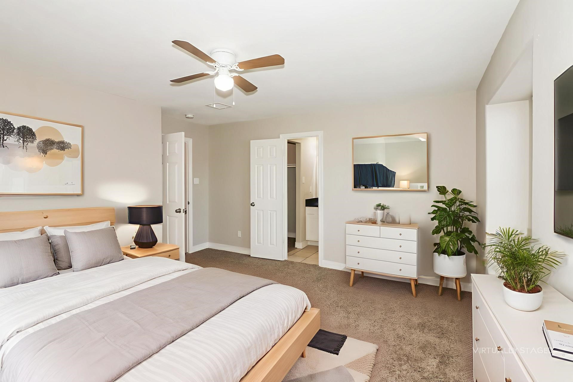 214 North Native Lane Houston, TX 77022 - Photo 10 of 18 a bedroom with a large bed and a chandelier