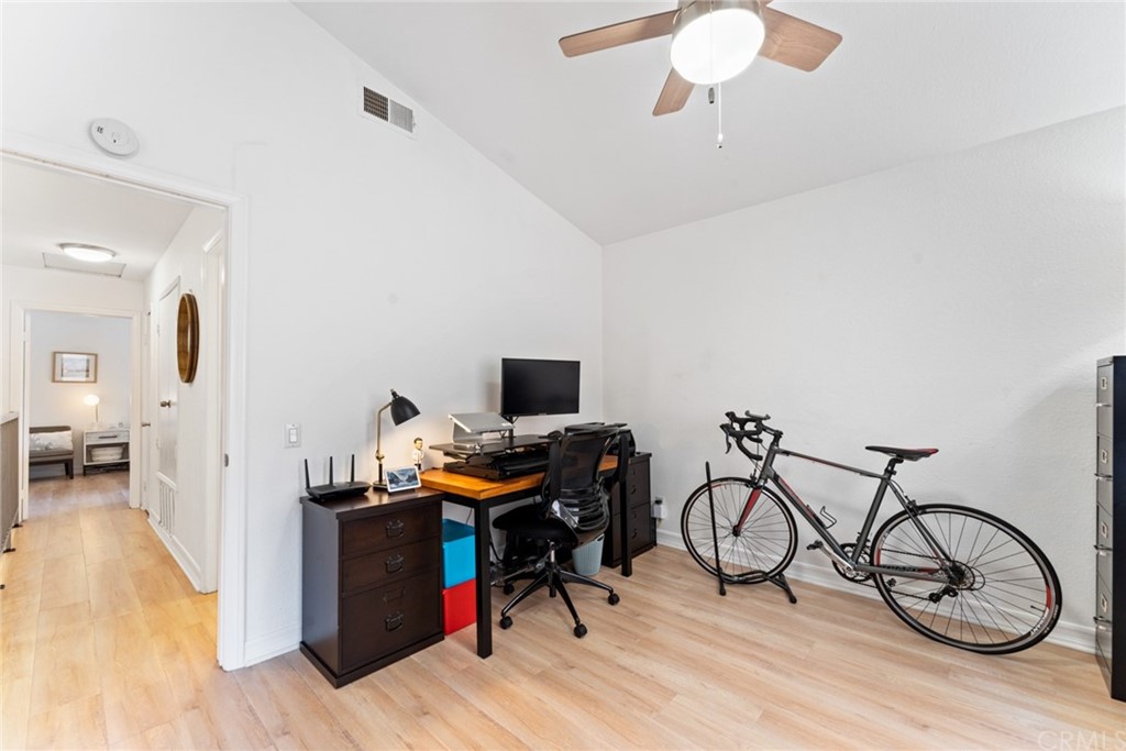 350 Burchett Street, Unit 101 Glendale, CA 91203 - Photo 16 of 27 a view of a workspace with furniture and wooden floor