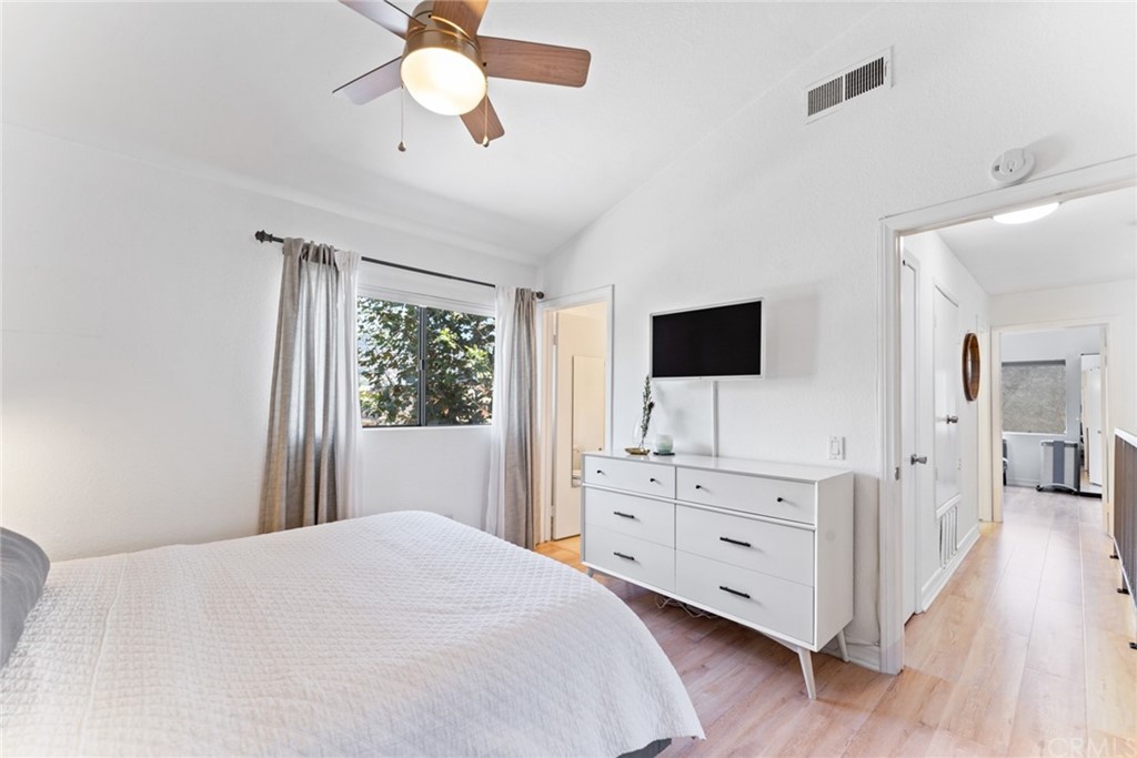 350 Burchett Street, Unit 101 Glendale, CA 91203 - Photo 19 of 27 a bedroom with a bed and a flat screen tv