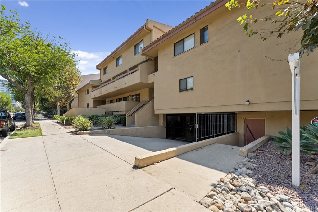 350 Burchett Street, Unit 101 Glendale, CA 91203 - Photo 2 of 27 a view of a house with a yard
