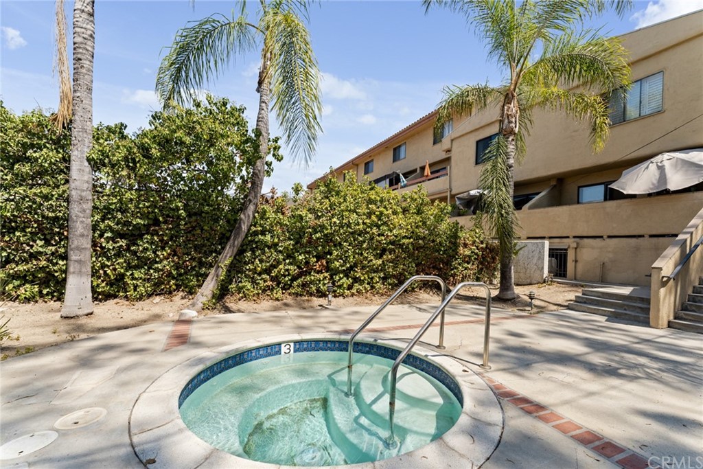 350 Burchett Street, Unit 101 Glendale, CA 91203 - Photo 24 of 27 a swimming pool with outdoor seating and yard