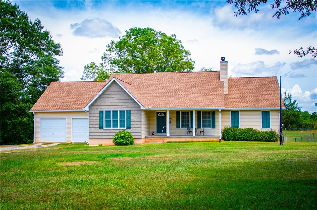 500 Dashboard Road Bowdon, GA 30108 - Photo 1 of 1 a front view of a house with a yard
