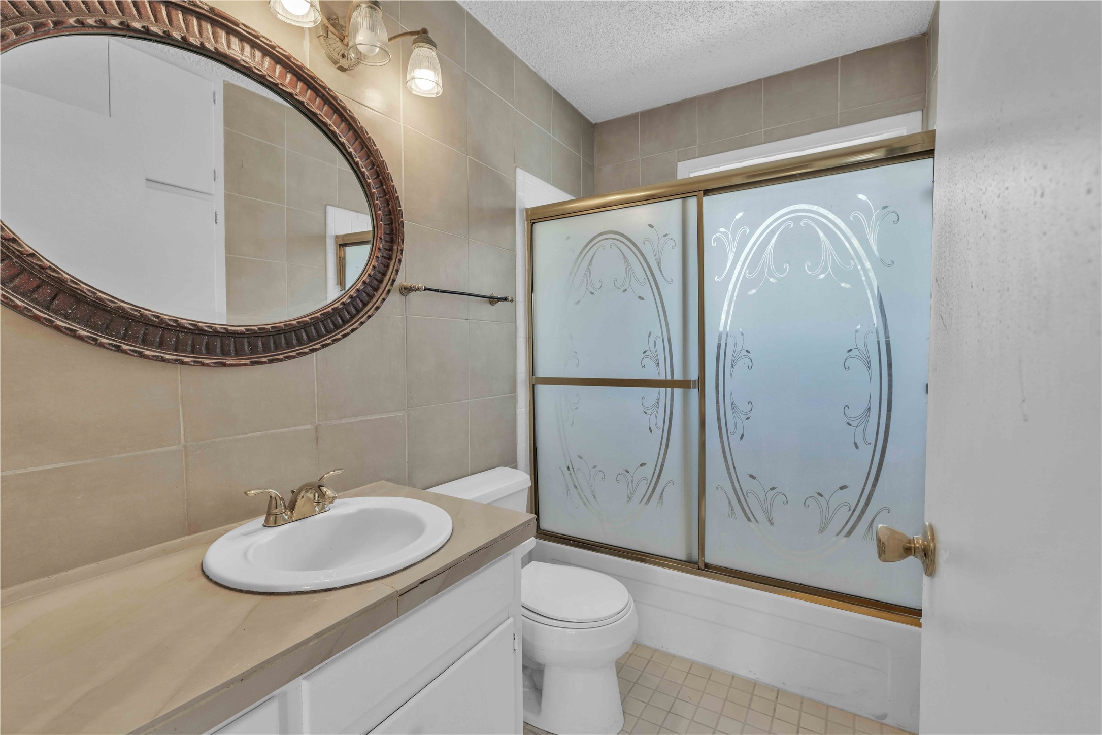 5210 Woodrow Avenue, Unit B Austin, TX 78756 - Photo 11 of 23 a bathroom with a toilet a sink and mirror