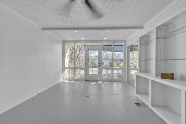 a view of an empty room and window