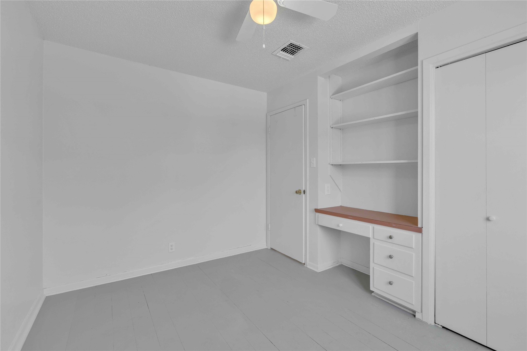 5210 Woodrow Avenue, Unit B Austin, TX 78756 - Photo 15 of 23 a room with a closet and a lamp