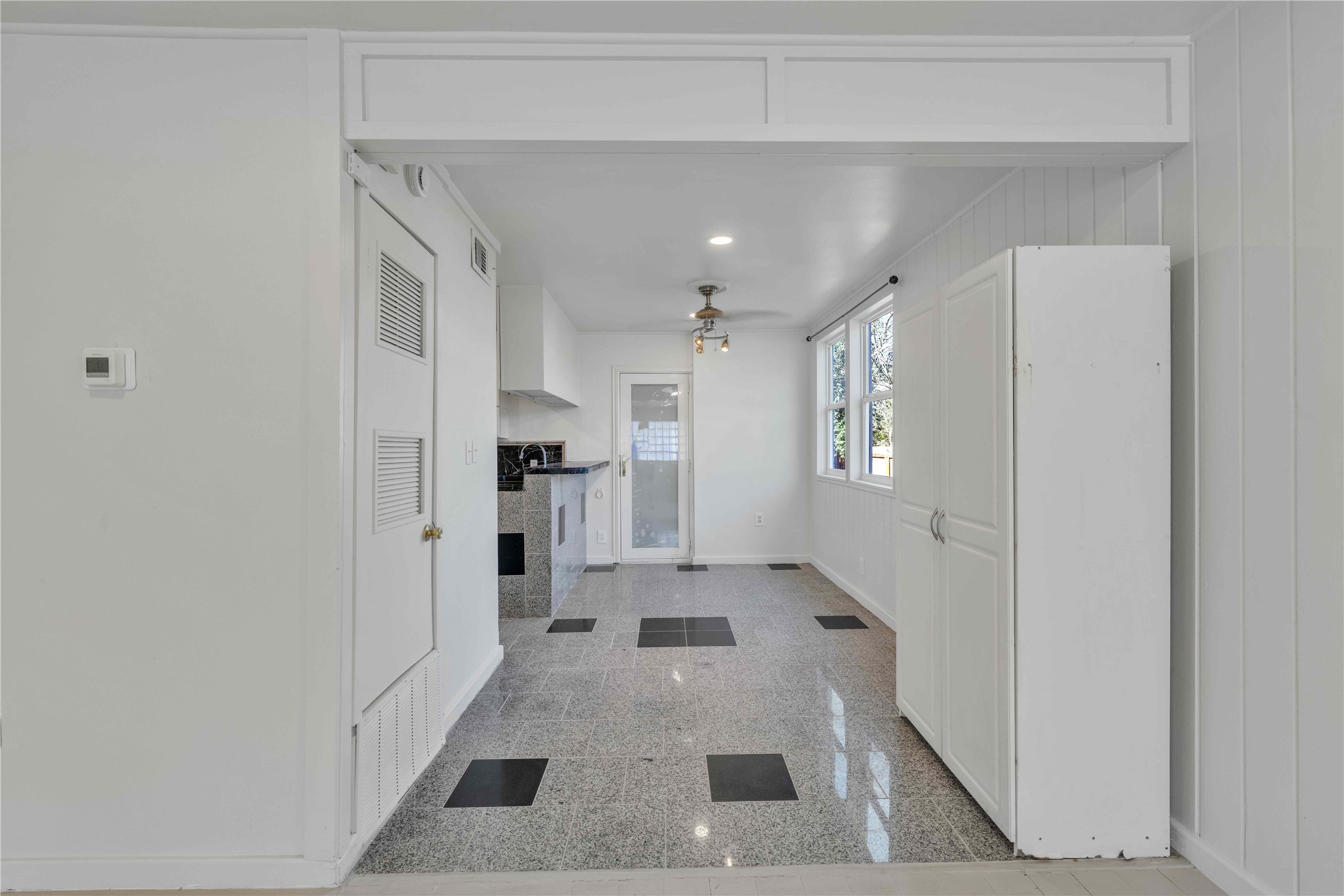 5210 Woodrow Avenue, Unit B Austin, TX 78756 - Photo 6 of 23 a kitchen with stainless steel appliances kitchen island a refrigerator and a sink